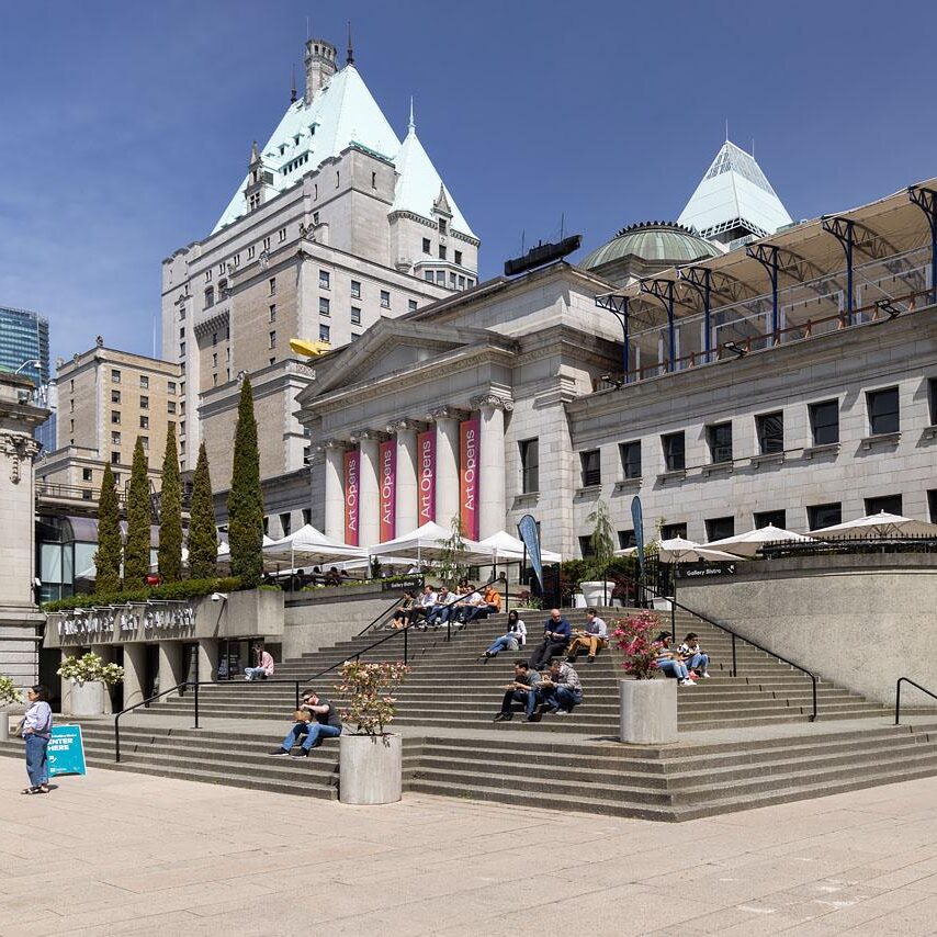 Exterior shot of the Vancouver Art Gallery's Robson Street entrance with the Bistro stairs and people visible in the foreground.