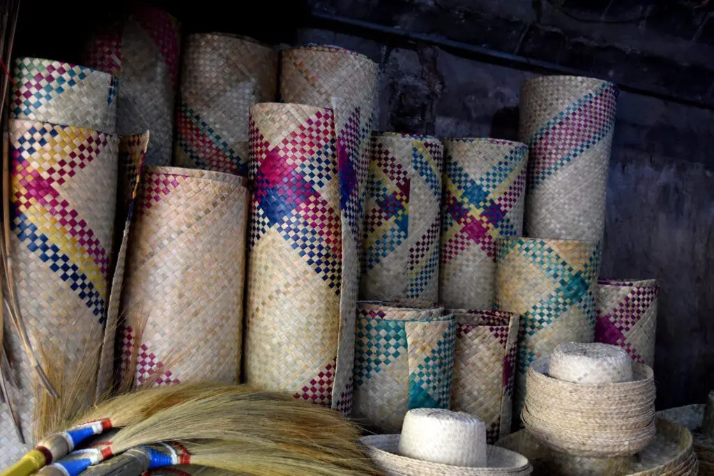 Rolled-up, handwoven mats and hats