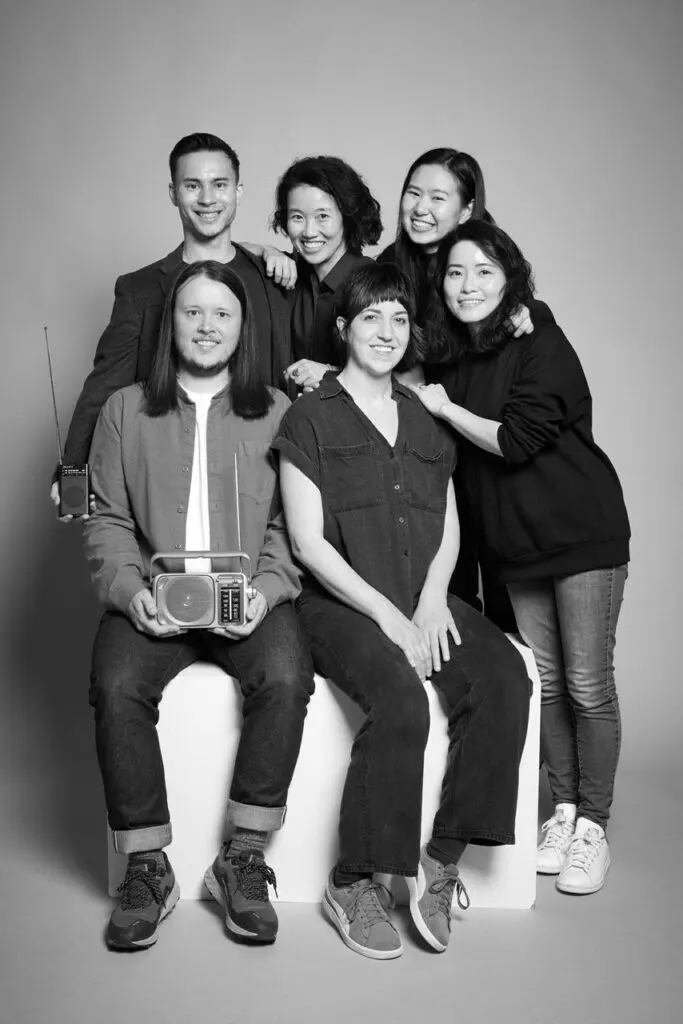 A group of 6 people, part of a black-and-white headshot