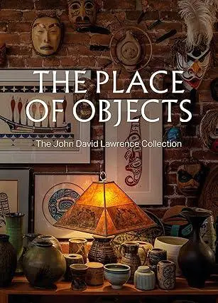 Cover for the catalogue The Place of Objects. Image is of a lit lamp in surrounded by ceramic and art objects