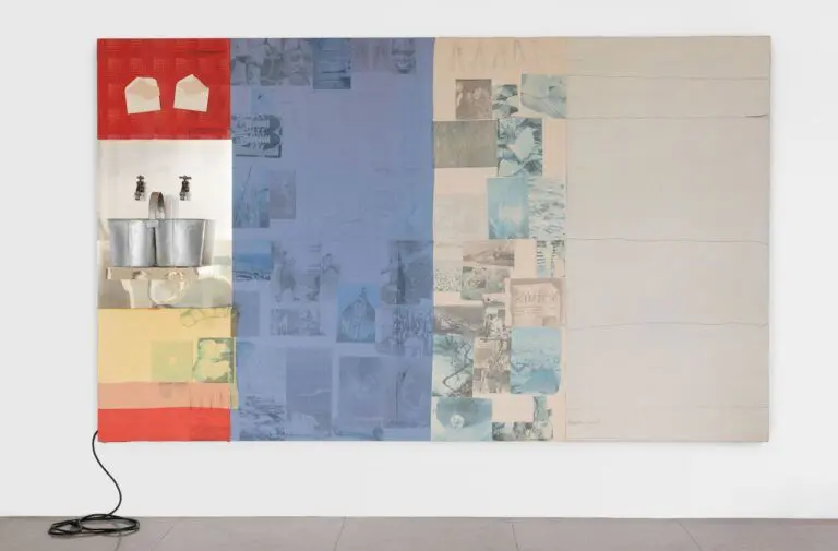 Artwork by Robert Rauschenberg with two taps and a canvas of red, blue and white.