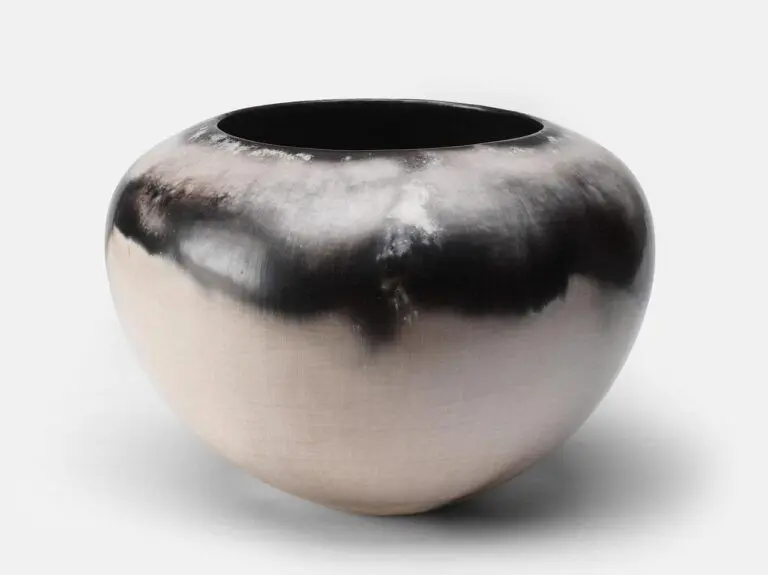 Ceramic bowl with black on top and white on the bottom